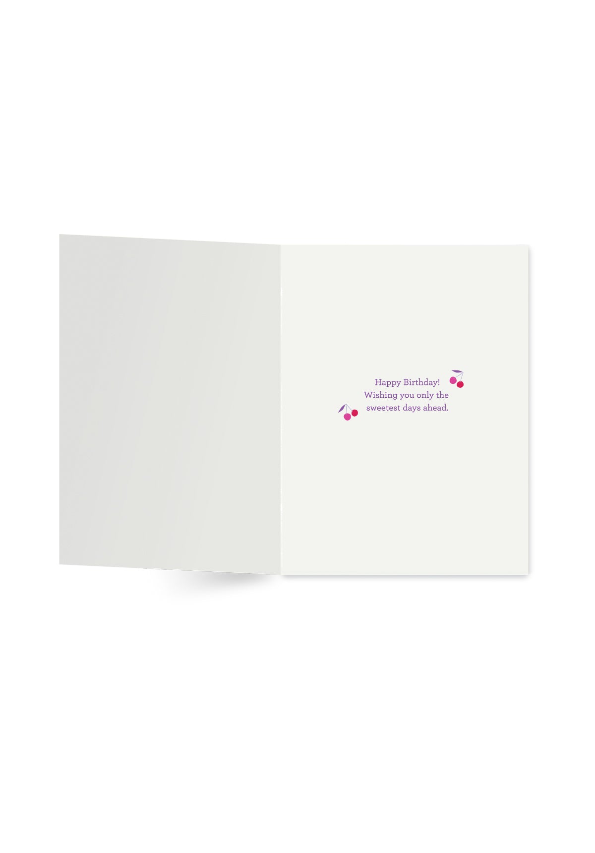 Open white card with text and cherry designs on a white background.
