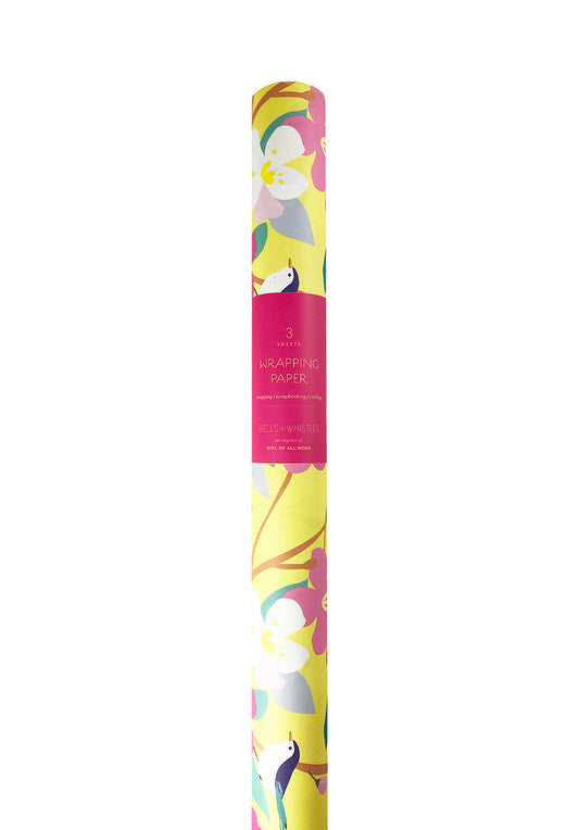 Roll of wrapping paper with flower and bird illustrations on a soft yellow background. 