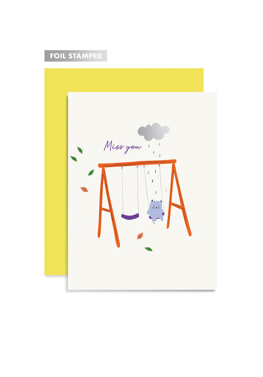 Greeting card with cat illustrations and 'Miss you' text, paired with a yellow envelope.