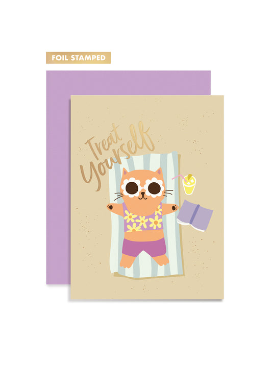Greeting card with a cat illustration and 'Treat Yourself' text, foil stamped,  paired with a purple envelope.