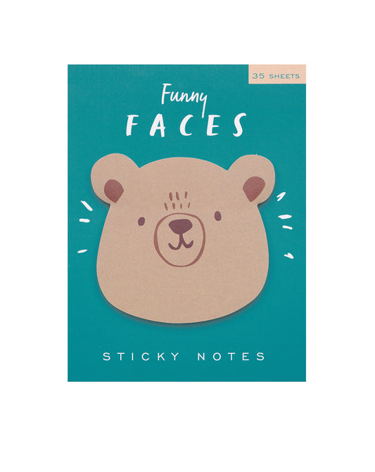 Die cut sticky notes with a bear face design on a pale green background.