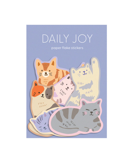 Pack of flake stickers with cat designs on a blue background, labeled 'Daily Joy'.
