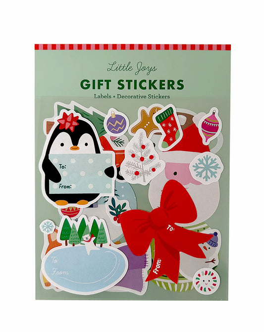 A package of Little Joys Christmas gift stickers featuring penguins, Santa, trees, ornaments, and holiday-themed labels on a mint green background.
