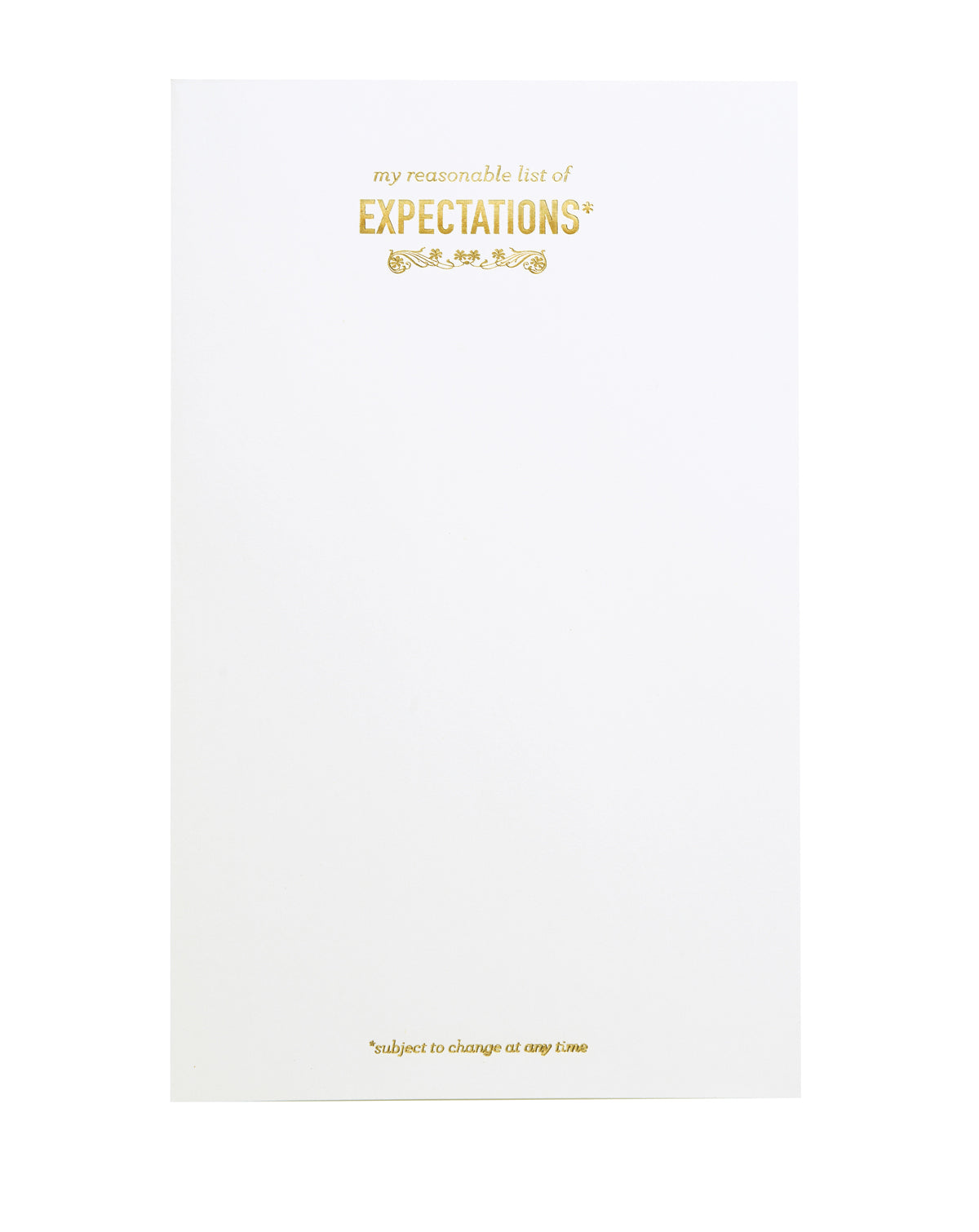 White notepad with gold foil text. "my reasonable list of EXPECTATIONS*" is printed at the top, and "*subject to change at any time" is printed at the bottom. 