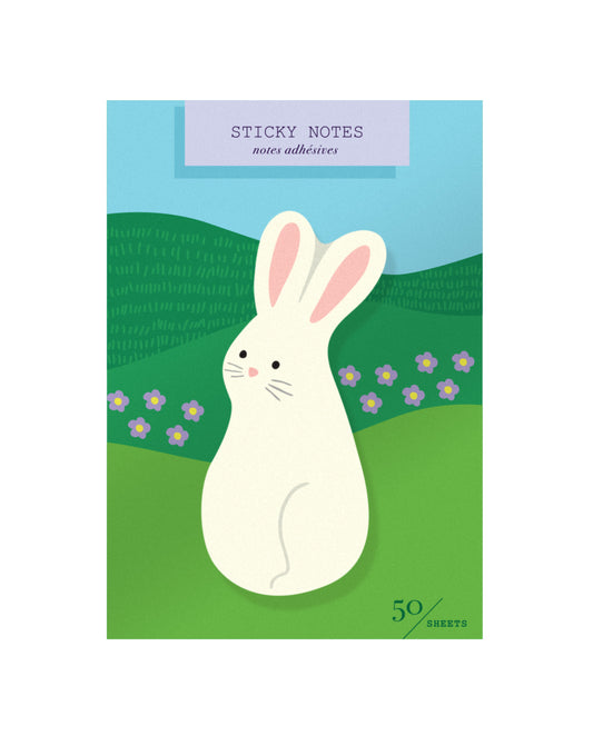 Package of die-cut sticky notes featuring a bunny on a packaging card illustrated with hills and flowers