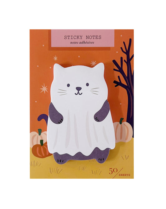 A pack of Halloween-themed sticky notes featuring a cute white cat dressed as a ghost with purple sleeves and feet, set against an orange and yellow autumn background with pumpkins and a bare tree.