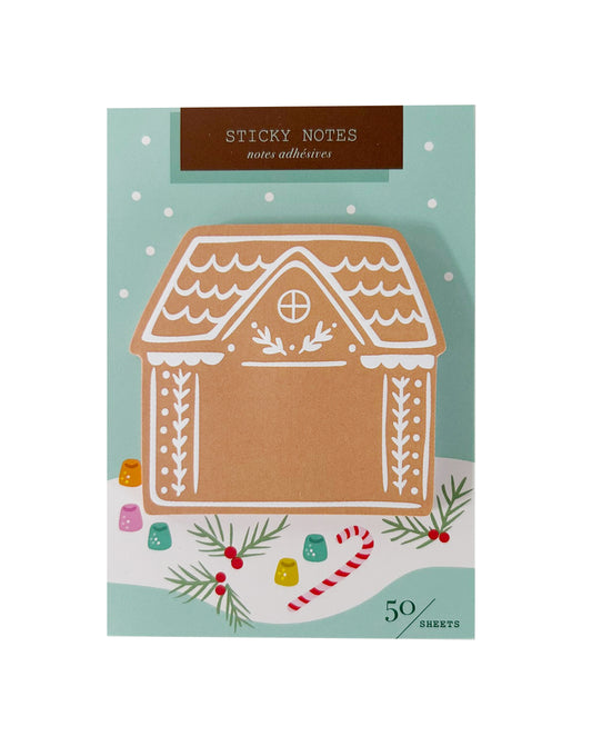 A pack of Christmas-themed sticky notes featuring a gingerbread house illustration on a mint green background with holiday decorations and the text 'STICKY NOTES' and '50 sheets'.