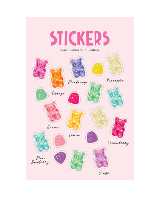 Sheet of colorful clear gummy bear stickers with labels on a pink background