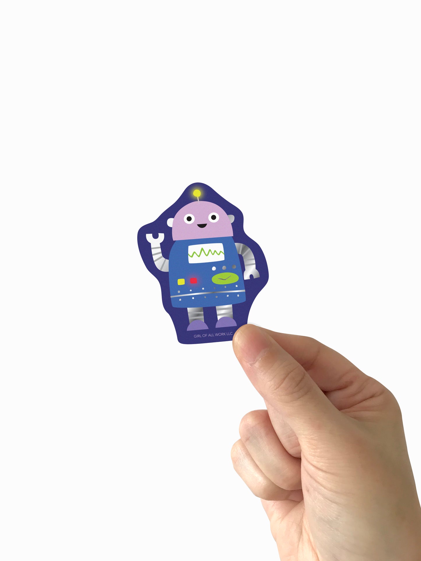 Hand holding a colorful vinyl, foil stamped robot sticker against a white background