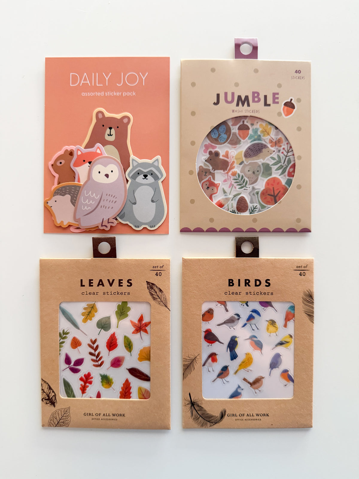A flat-lay display of Woodland Friends Jumble Washi Stickers, Forest Animals Flake Stickers, Birds Wildlands Stickers, and Leaves Wildlands Stickers, featuring cute woodland animals, birds, and leafy designs.